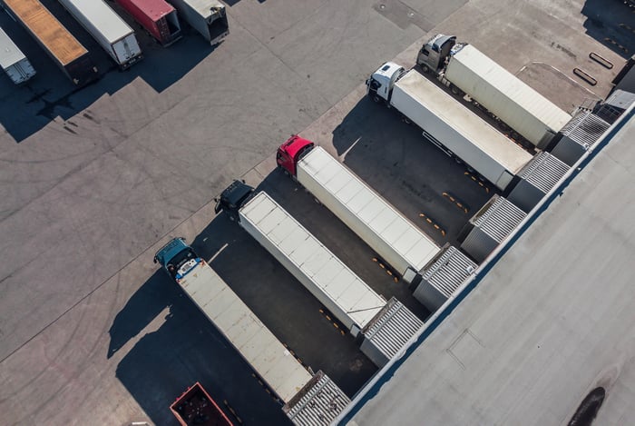 trucks-unloading-in-logostics-hub-2022-01-30-07-15-06-utc