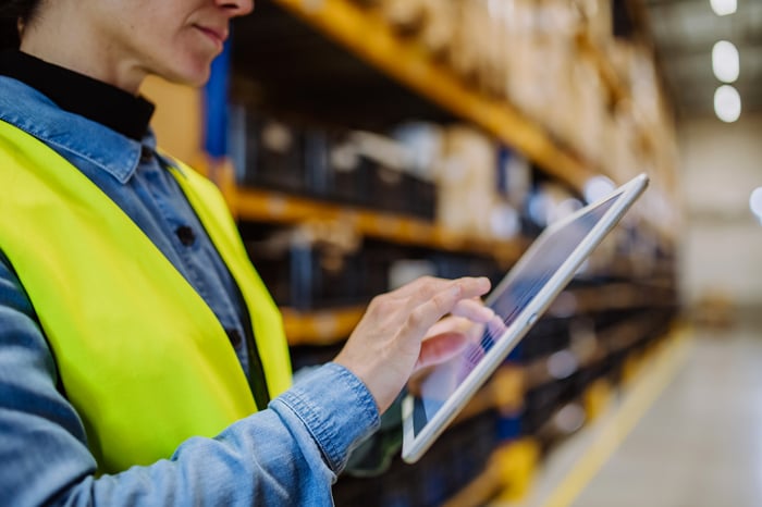 warehouse-female-worker-checking-up-stuff-in-a-war-2023-03-28-00-58-33-utc