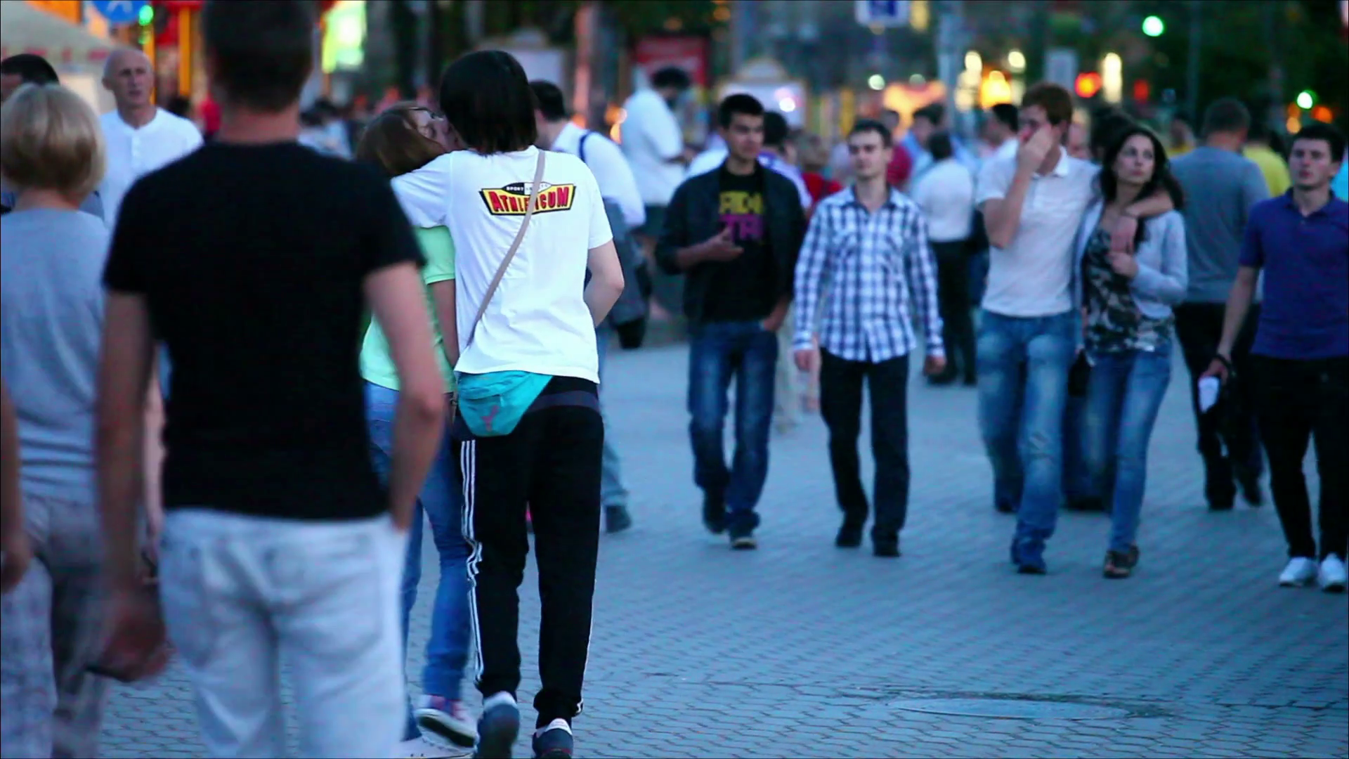 people-walking-down-the-street-in-the-evening_blxknx1q_thumbnail-full01